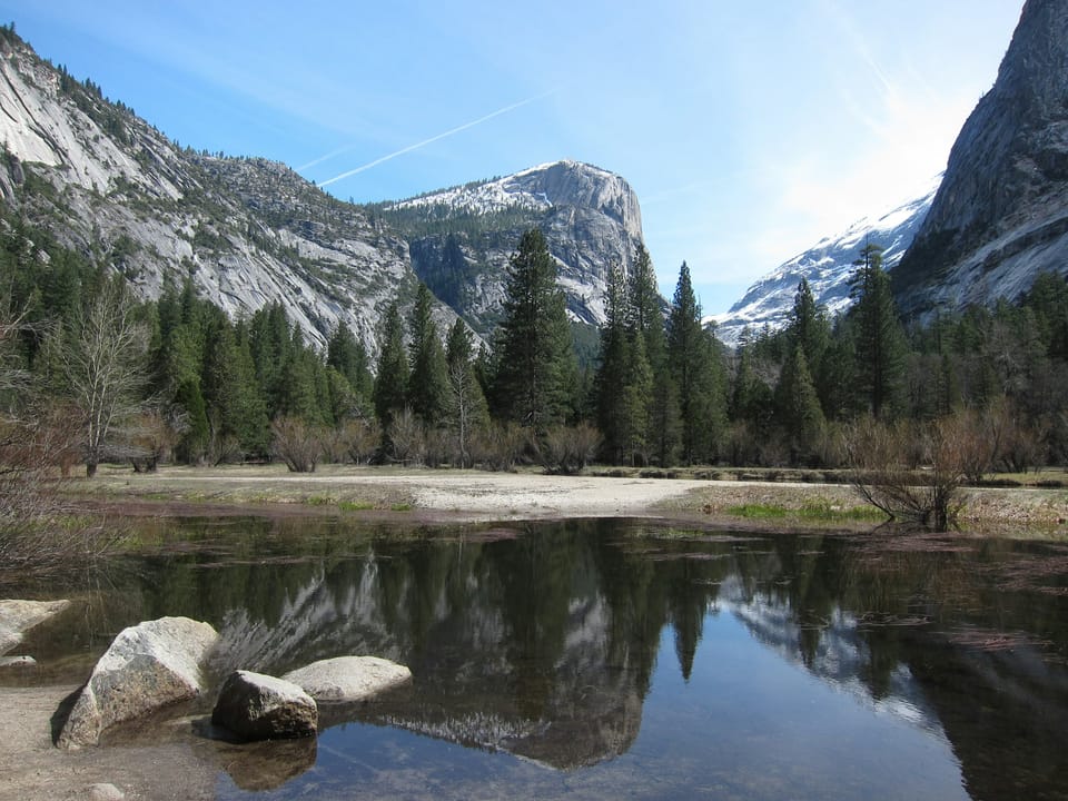 Mirror Lake reflecting Yosemite granite and pine trees